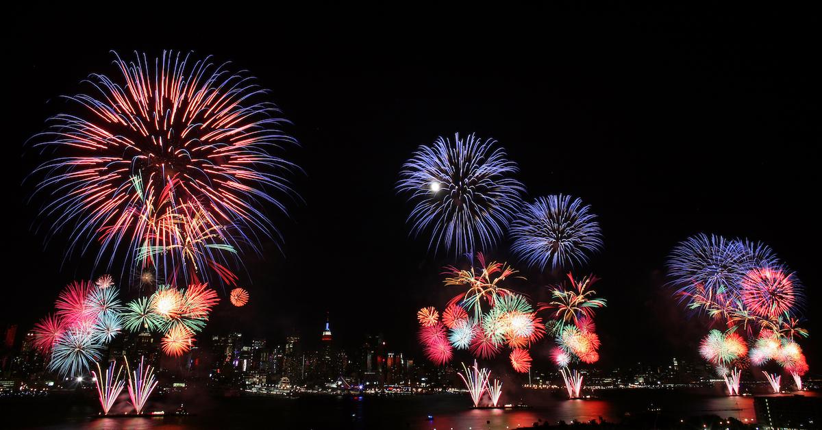 Fireworks explode with the NYC skyline in the background