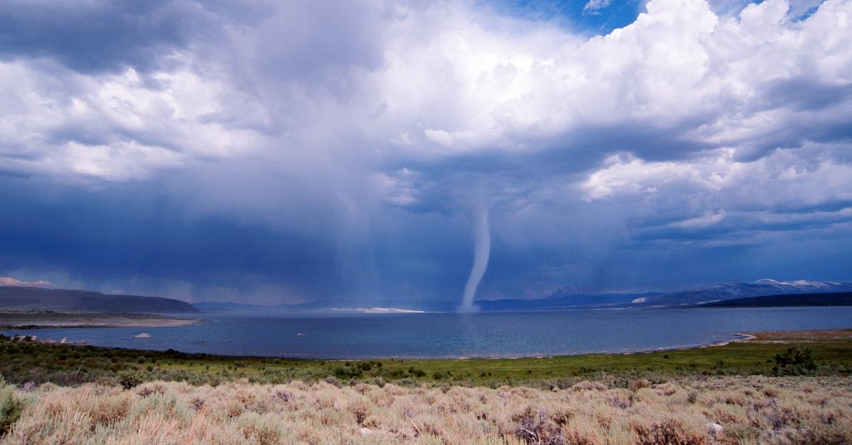 Photograph of a tornado over water. 